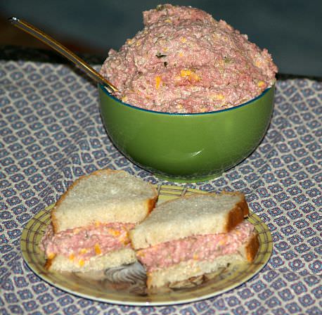 Ham salad with cheese takeaway sandwich on white bread in plastic