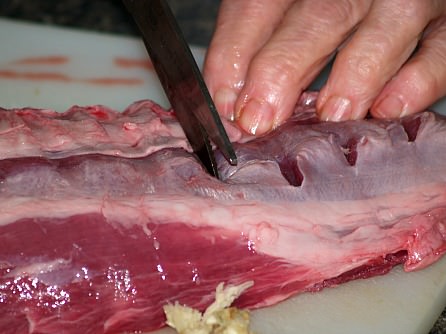 Placing Slits in Lamb for Garlic